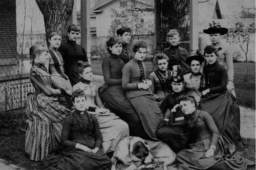 female students posing in black and white photo from early years of the University