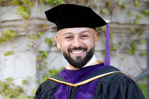 Mohammed Al Mulhim, bearded, in graduation cap.